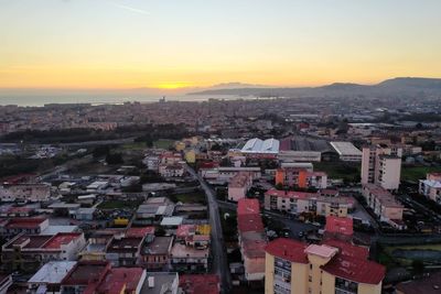 High angle view of townscape against sky during sunset
