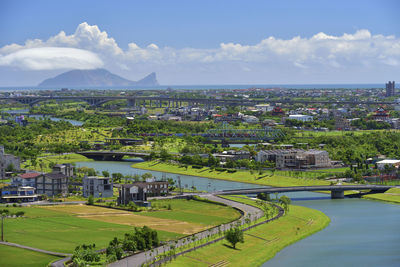 High angle view of buildings in city against sky