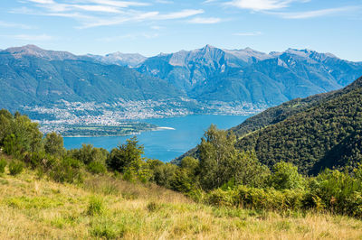 Aerial view of locarno and the swiss alps from an alpine pasture