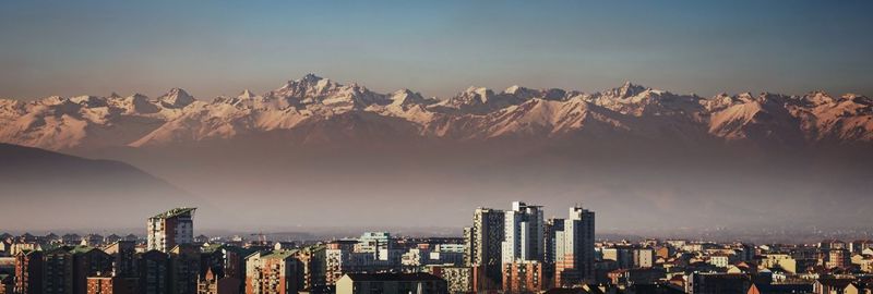 Panoramic view of city buildings against sky