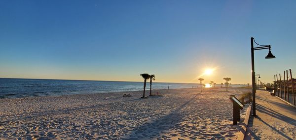 Scenic view of sea against clear sky during sunset