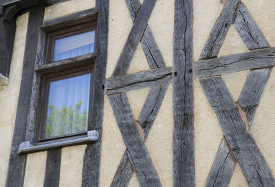 Low angle view of window of old building