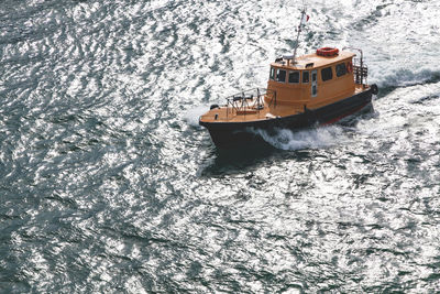 High angle view of ship sailing in sea