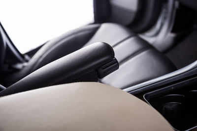 Low section of woman sitting in car