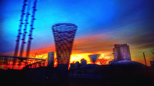 Low angle view of built structure against sky at sunset