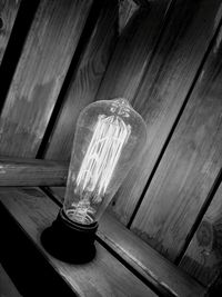 High angle view of illuminated light bulb on table