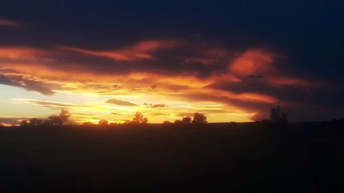 Scenic view of silhouette landscape against sky during sunset