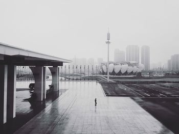 People in city against clear sky