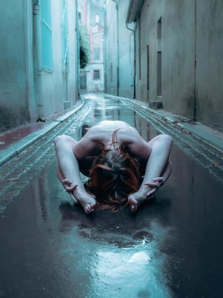 one person, sadness, full length, young adult, architecture, adult, lying down, depression - sadness, women, front view, emotion, young women, horror, spooky, fear, hopelessness, alley