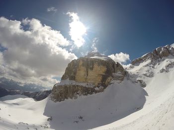 Scenic view of mountains against cloudy sky