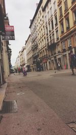 People walking on street in city