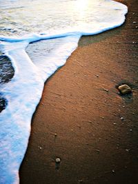 Close-up of wet sand on beach