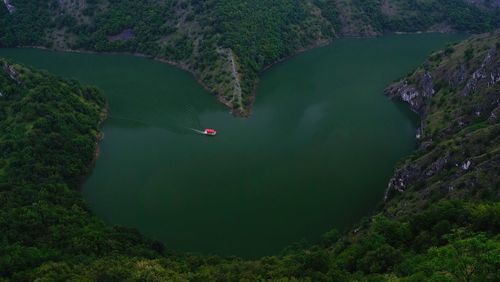 Aerial view of river amidst mountains