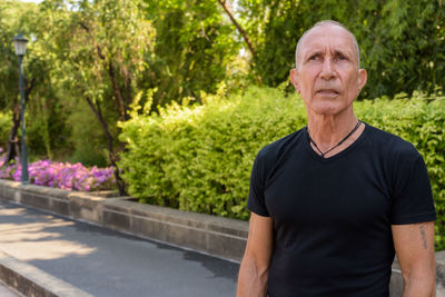Portrait of man against plants