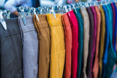 Multi colored pants hanging for sale in store