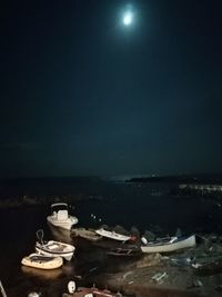 High angle view of breakfast on table against sea at night