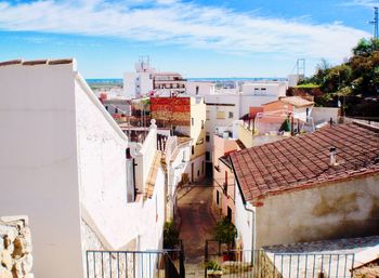 High angle view of buildings in city against sky