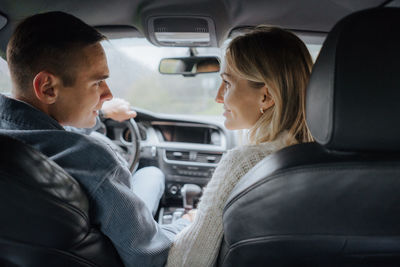 Loving couple in the car.