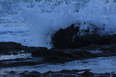 Sea waves splashing on rocks