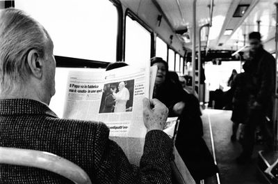 Rear view of people sitting in bus