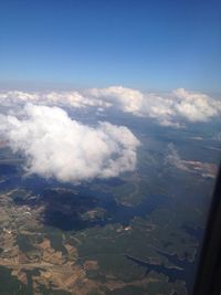 Aerial view of landscape against cloudy sky