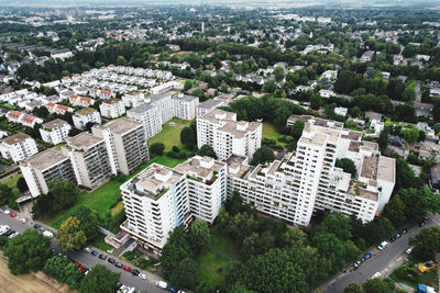 High angle view of buildings and trees in city