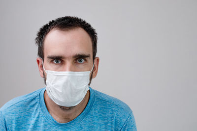 Portrait of mid adult man against white background