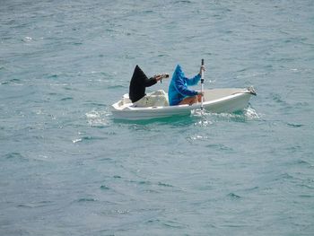 Man in boat on sea