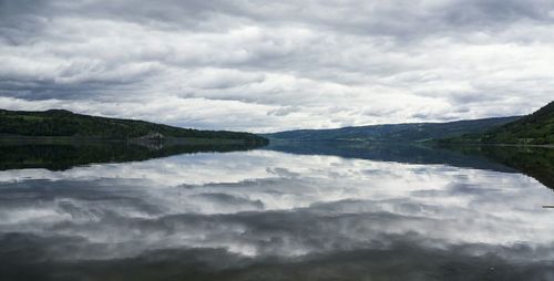 Scenic view of sea against cloudy sky