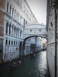 Bridge of sighs over gondolas on canal