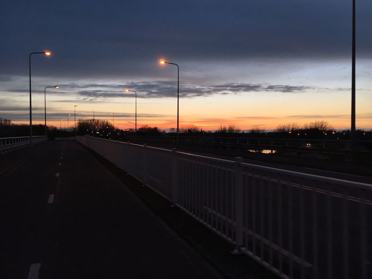 ROAD AGAINST SKY AT NIGHT