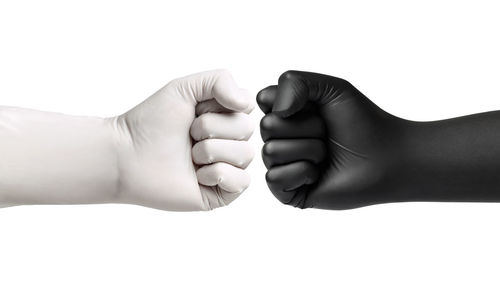 Close-up of hands over white background