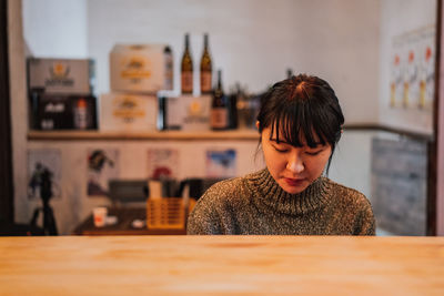 Portrait of woman sitting in cafe