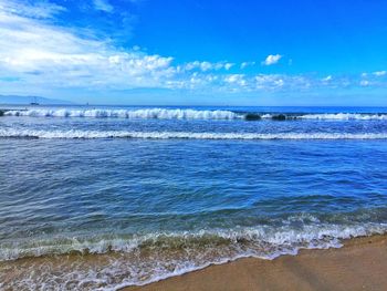 Scenic view of sea against cloudy sky