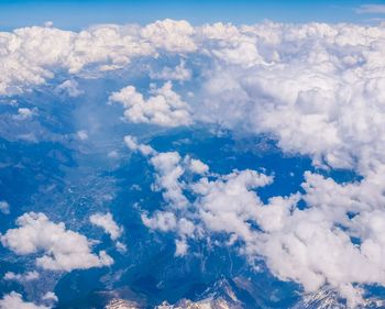 Aerial view of landscape against cloudy sky