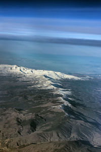 Scenic view of beach against blue sky