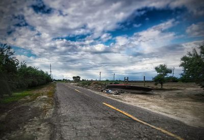 View of road against cloudy sky