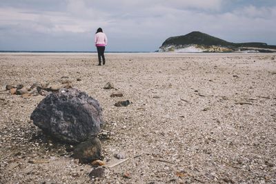 Full length of man standing on beach