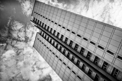 Low angle view of building against cloudy sky