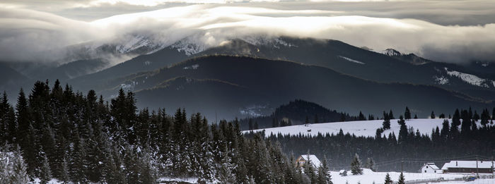 Panoramic shot of snowcapped mountains against sky