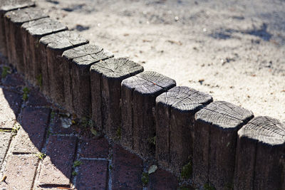 Wooden edge to a sandbox outdoors