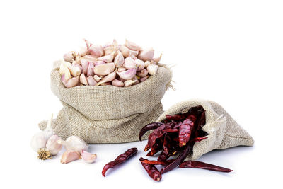 Close-up of garlic on white background