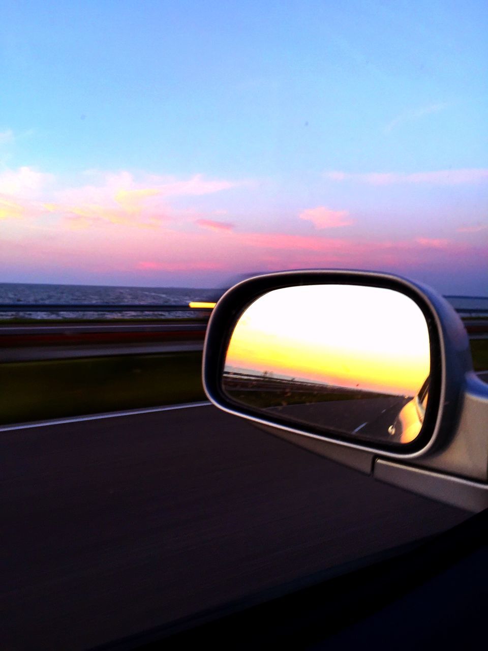 sky, transportation, sunset, reflection, mode of transport, glass - material, window, transparent, part of, no people, orange color, cropped, sunlight, close-up, car, indoors, cloud, vehicle interior, silhouette, blue