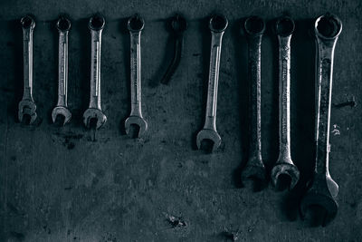 Close-up of wrench on wall