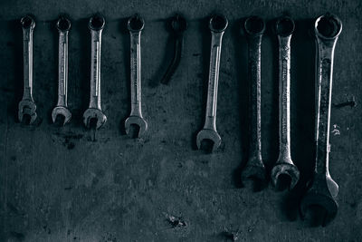 Close-up of wrench on wall