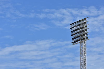 Low angle view of floodlight against sky