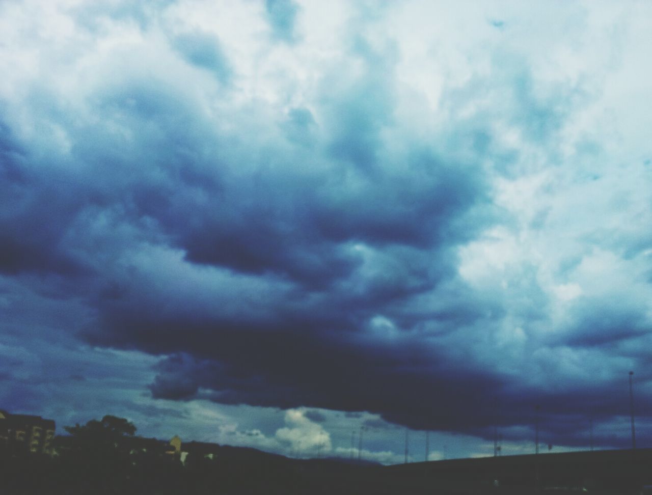 sky, cloud - sky, cloudy, weather, low angle view, overcast, storm cloud, cloudscape, beauty in nature, scenics, tranquility, nature, cloud, dramatic sky, tranquil scene, atmospheric mood, silhouette, dusk, idyllic, outdoors