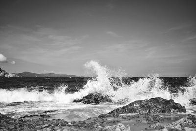 Waves splashing on rocks