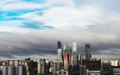 Modern buildings in city against sky