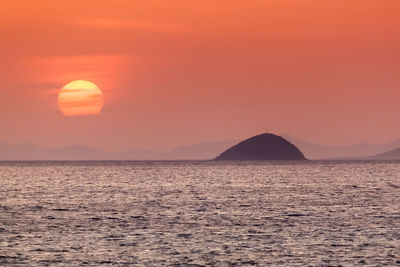 Scenic view of sea against romantic sky during sunset